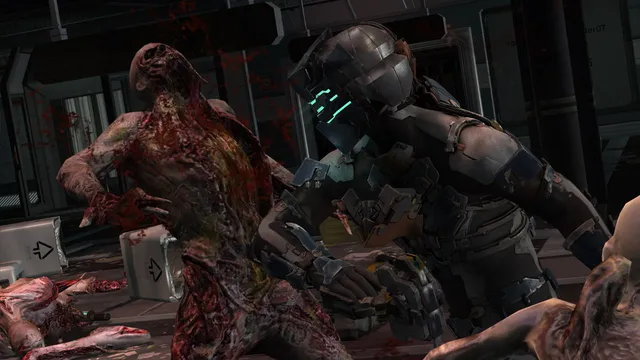 Dead Space 2 screenshot: a bloody Necromorph grabs Isaac in his engineering suit