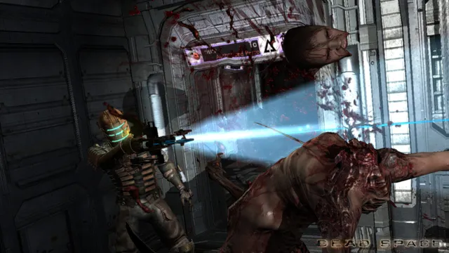 Isaac Clarke in his engineering suit fires a blue plasma beam at a lunging, flayed Necromorph in a blood-spattered corridor