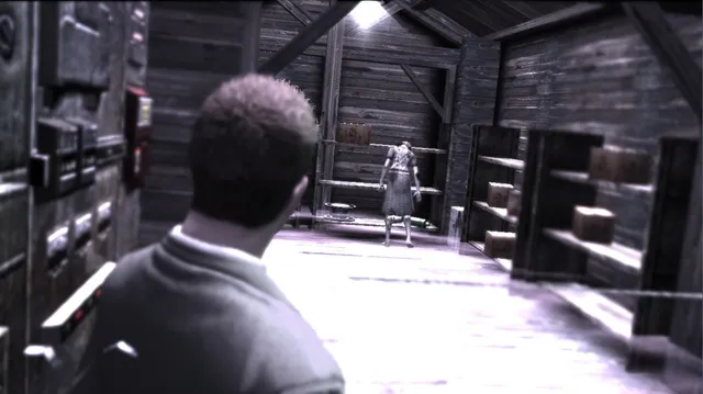 York stands in a dim wooden storeroom as a pale, broken shadow figure in a dress waits between the shelves