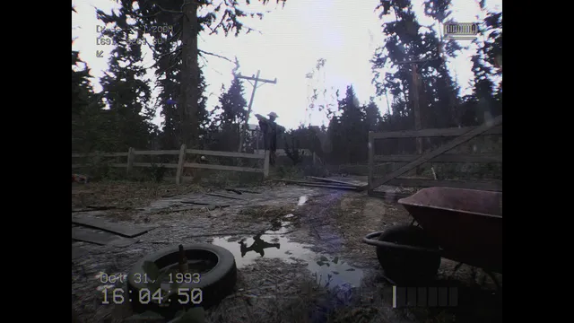 DON'T SCREAM screenshot: camcorder footage of a muddy farmyard with a scarecrow, a tyre and a wheelbarrow, time stamped 16:04:50