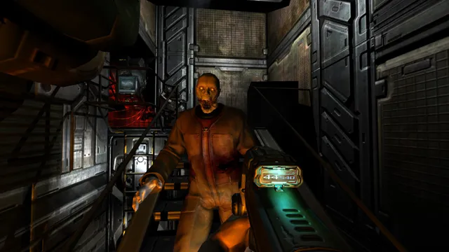 A possessed base worker in an orange jumpsuit lurches out of the dark toward the player's gun