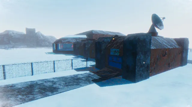 The ARK 2 research base half buried in snow, with a satellite dish on its roof