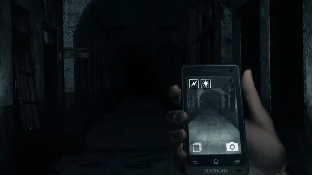 First-person view of Linda holding her phone up in a dark corridor, its screen showing the camera view