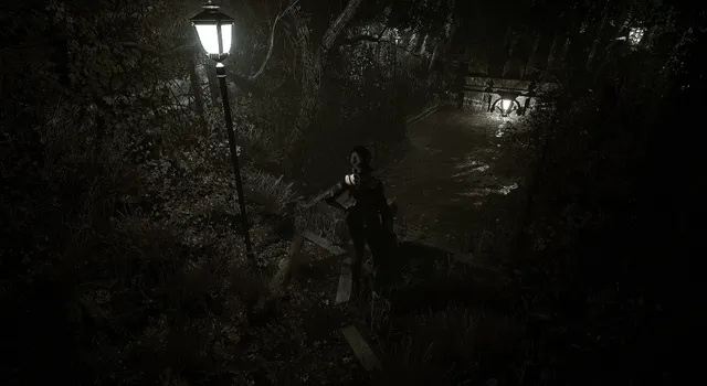 Laurel walks a dark overgrown park path lit by old street lamps
