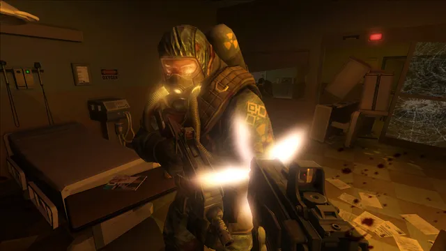 A soldier in a hazmat suit and gas mask fires at close range in a hospital room with a blood-stained floor