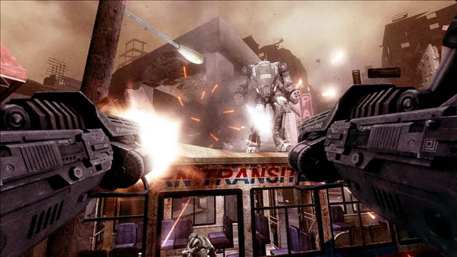 The player in a powered armour suit fires twin cannons at an enemy mech in a ruined street