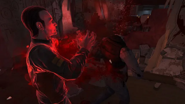 F.E.A.R. 3 screenshot: Fettel, glowing red, raises his hands as a soldier bursts apart in a spray of blood