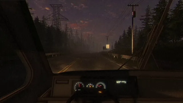 View from the cab of a truck driving down a foggy forest road at dusk, with power lines overhead