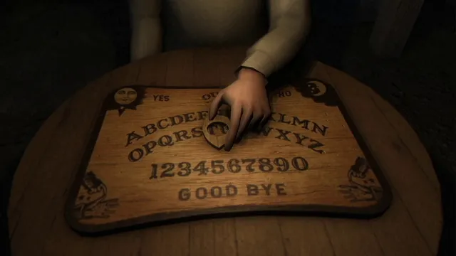 A hand on the planchette of a Ouija board on a round table