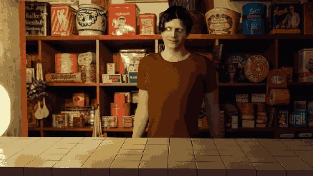 A pale man with an odd grin standing behind a shop counter in front of shelves of old tins