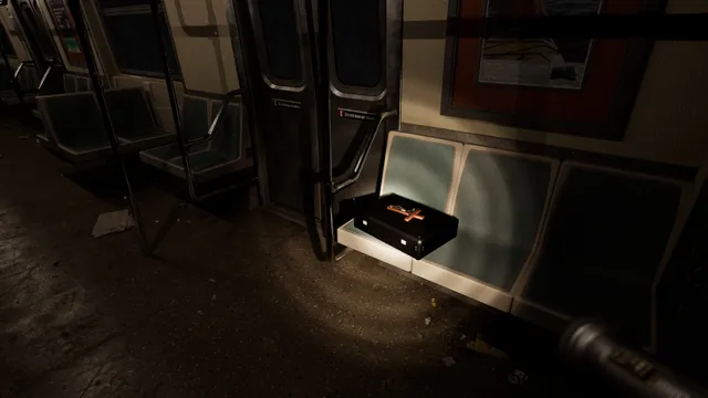 A flashlight beam falls on a black case with a red cross on its lid, left on a seat in a dark subway car