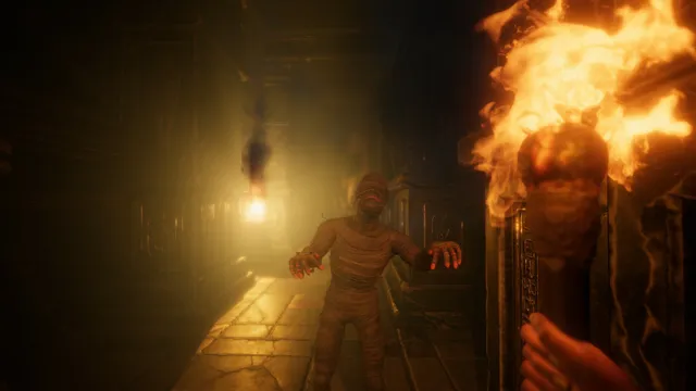 FOREWARNED screenshot: a wrapped mummy reaches out from a lit corridor while the player holds a burning torch