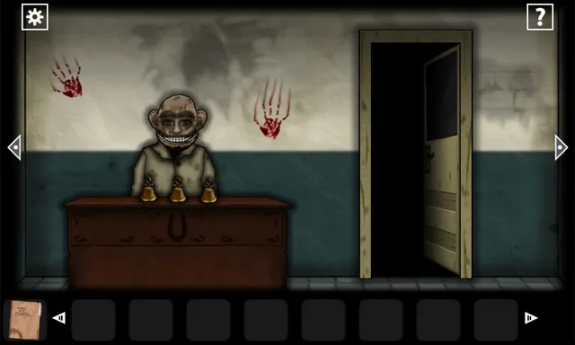 A grinning bald man sits behind a desk with bells, under bloody handprints on a clinic wall