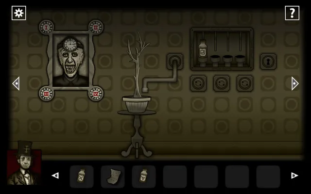 A wall puzzle with a portrait of a grinning old man, a dead plant on a pipe and three dials