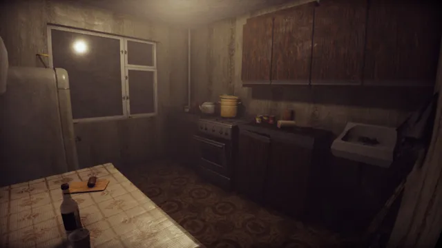 A cramped old kitchen with a gas stove, wooden cupboards and a bottle on the oilcloth-covered table