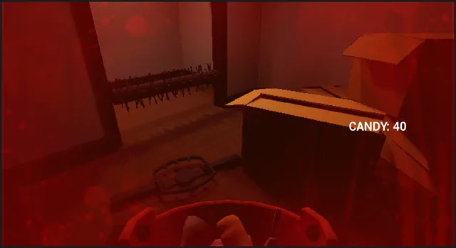A red-tinted room with a bear trap on the floor, boxes and spikes on the wall, candy counter at 40