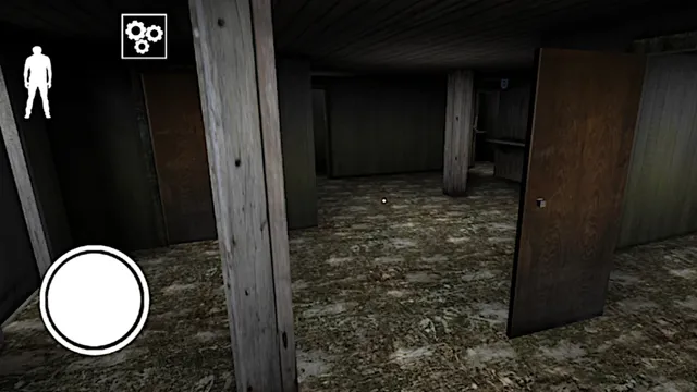 Granny: Chapter Two screenshot: a dark basement with wooden posts and an open door