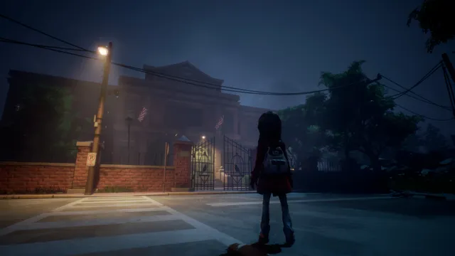 GYLT screenshot: Sally with her backpack stands at a crossing at night, facing the lit gates of a red-brick school