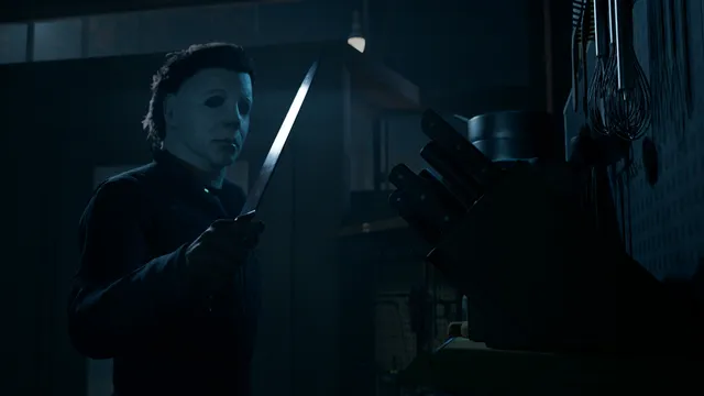 Halloween: The Game screenshot: Michael Myers raises a kitchen knife in a dark kitchen