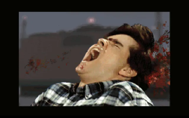 A digitized video shot of a young man screaming as blood sprays behind him