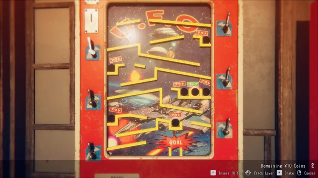 Hollow Cocoon screenshot: a red ten-yen pinball machine with a U.F.O. space board, levers on each side and a GOAL at the bottom