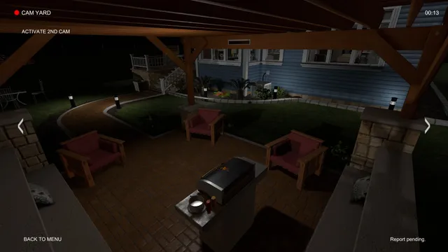Camera view of the house's back patio at night, with red chairs, a barbecue and a lit garden path
