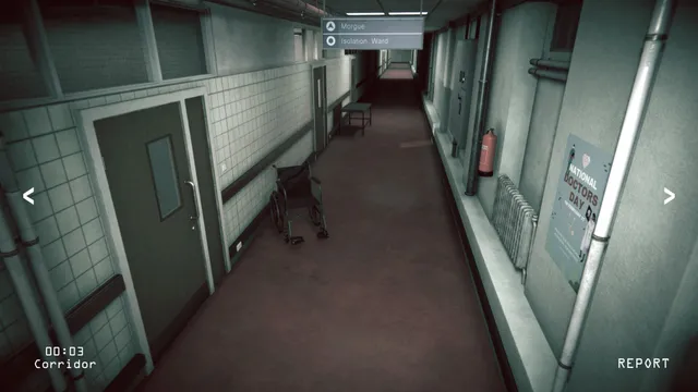 Camera view of a hospital corridor with a wheelchair by a tiled wall, timestamped 00:03