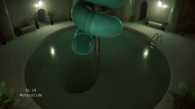 Camera view of an indoor pool with a green spiral waterslide, timestamped 01:18 and labelled Waterslide