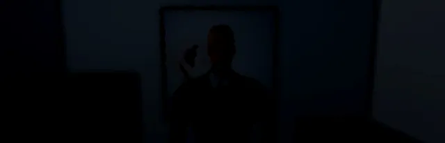 I'm on Observation Duty key art: the dark silhouette of a man standing in a shadowy doorway