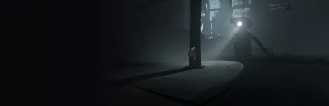 INSIDE key art: the boy hides behind a pillar in a dark factory while a machine sweeps the room with a searchlight