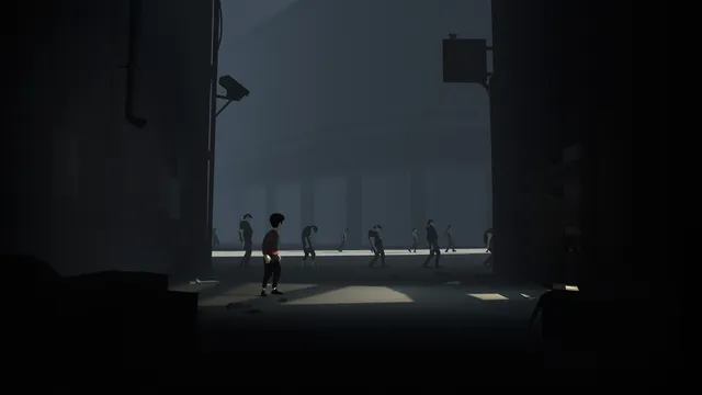 The boy stands in a dim hall as a line of grey, lifeless people walks past behind him