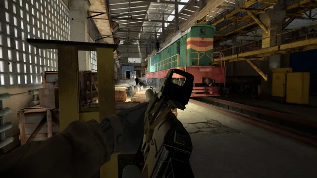 Into the Radius screenshot: holding a rifle with a red-dot sight inside an engine shed with a locomotive