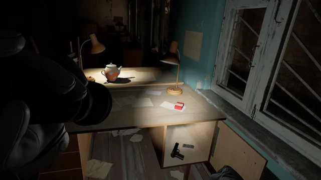 Into the Radius screenshot: a dim abandoned office with a desk lamp, a teapot and a pistol on the floor