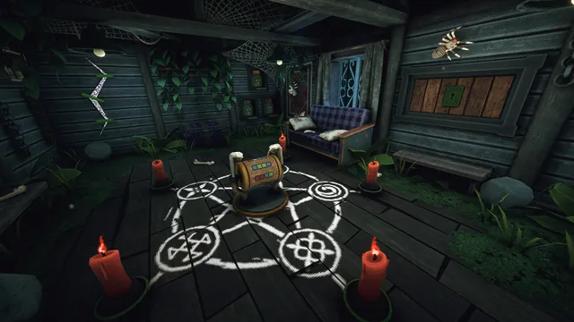 A device in the middle of a chalk circle of symbols with red candles, on the floor of the forest shack