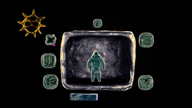 Isolomus screenshot: a clay figure standing in a clay box, surrounded by small tiles and a spiky sun