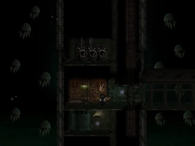 It Moves screenshot: the boy at a desk inside a rusted underwater base, with pale jellyfish drifting in the dark water around it
