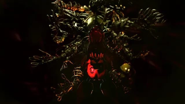 A tangled animatronic of wires and gold limbs with a red glowing face in a dark basement