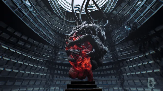 A huge red fleshy mass hanging from cables in the middle of a circular atrium