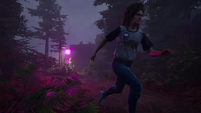 Killer Klowns screenshot: a young man sprints through a dark, purple-lit forest away from a glowing Klown