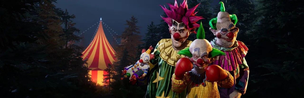 Killer Klowns key art: three grinning alien clowns stand in a dark pine forest beside a glowing striped circus tent