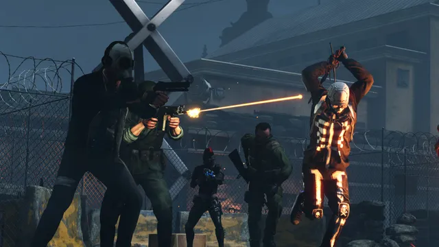 Killing Floor 2 screenshot: a squad of mercenaries shoots at a leaping Zed in a prison yard at night