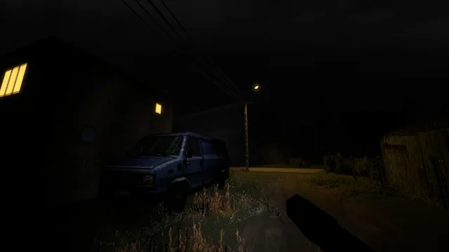 Krypta FM: a parked blue van beside a dark house and a single street lamp in the village at night
