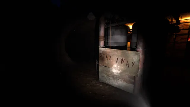 Labyrinthine: a flashlight picks out a wooden board painted STAY AWAY in a dark room