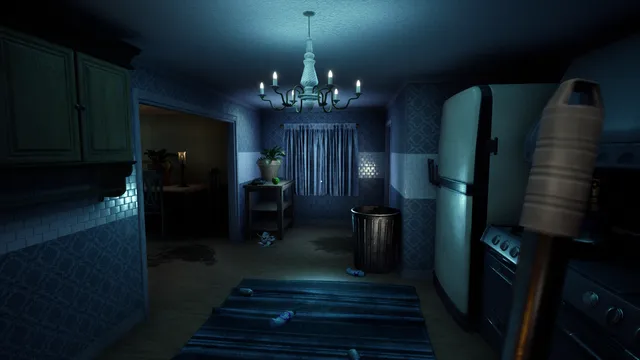 A dim kitchen with a chandelier, a fridge and a trash can, rubbish on the rug, the mop in hand