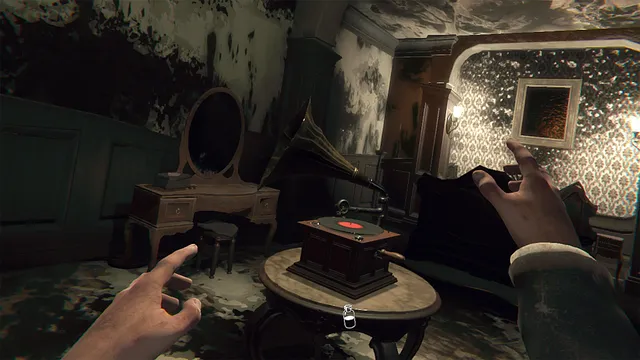 Layers of Fear VR screenshot: the player's two hands reach toward a gramophone on a round table in a stained Victorian bedroom with a vanity mirror