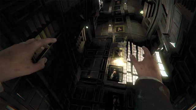 Layers of Fear VR screenshot: the player looks up a towering shaft of wood-panelled walls hung with portraits, hands raised