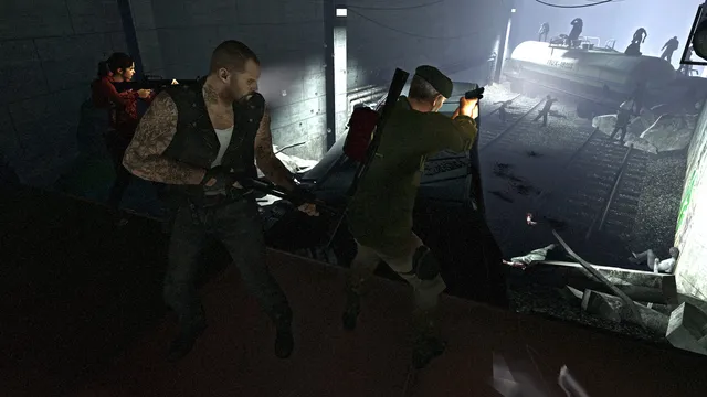 Left 4 Dead: three survivors fire down from a ledge at infected swarming over railway tracks and a tanker wagon
