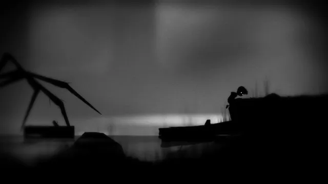 The giant spider's legs reach over dark water toward the boy on the bank