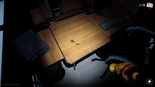 Lunch Lady screenshot: a key lying on a wooden desk next to a keyboard in a dark office