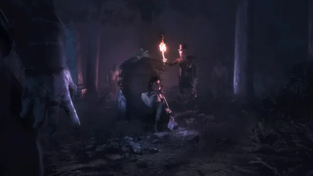 Maid of Sker screenshot: a woman hides behind a gravestone in a night forest while a figure with a torch searches nearby